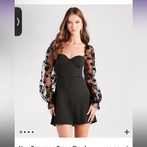 Black dress with mesh floral sleeves from Windsor. Size M